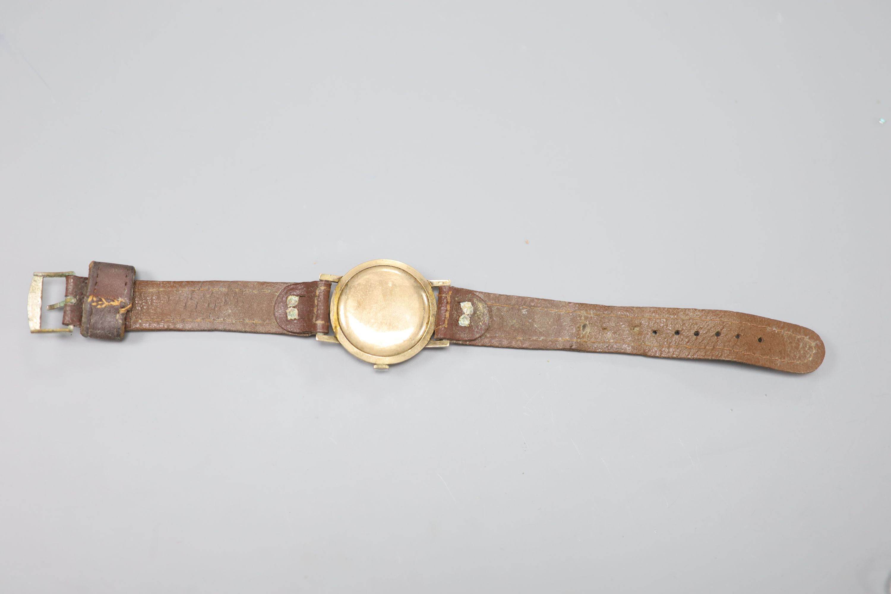 A gentlemans 9ct gold-cased Roldor wristwatch, with quarter baton numerals, on leather strap, gross 31.9 grams.